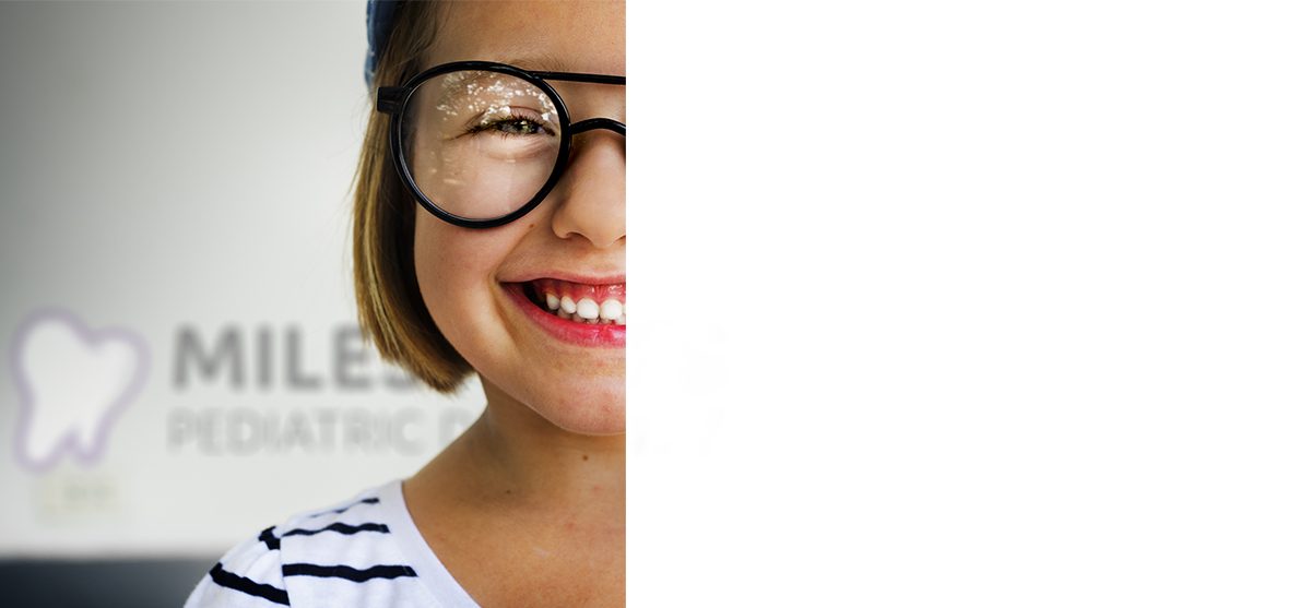 A young patient smiling at Milestones Pediatric Dentistry